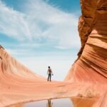 man on antelope canyon during daytime