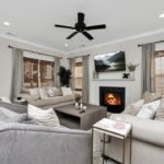 a living room filled with furniture and a fire place